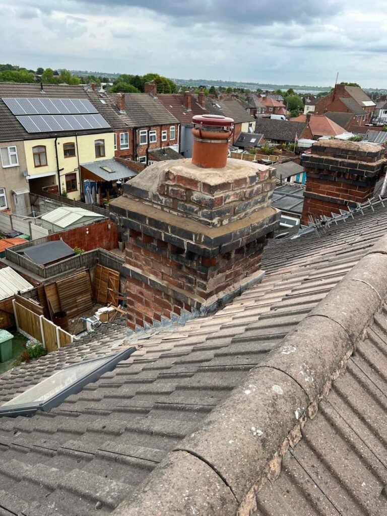 This is a photo taken from a roof which is being repaired by Beeston Roofing Repairs, it shows a street of houses, and their roofs